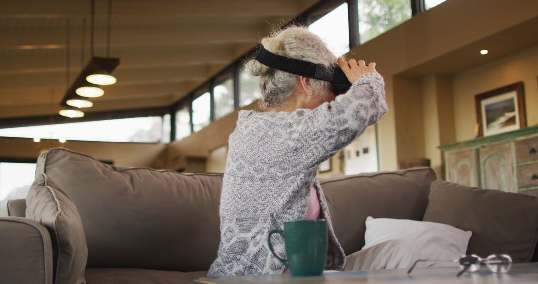 Elderly Woman Using Virtual Reality Headset at Home - Free Images, Stock Photos and Pictures on Pikwizard.com