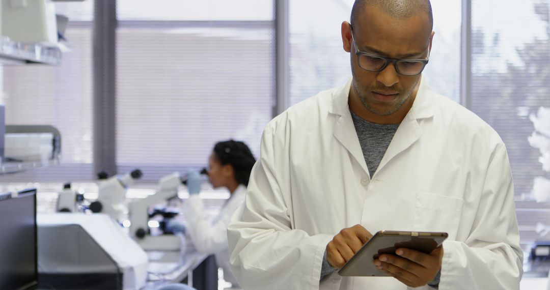 Focused Scientist Using Tablet in Modern Laboratory - Free Images, Stock Photos and Pictures on Pikwizard.com