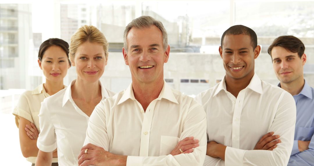 Diverse Professional Team Smiling in Office Environment - Free Images, Stock Photos and Pictures on Pikwizard.com