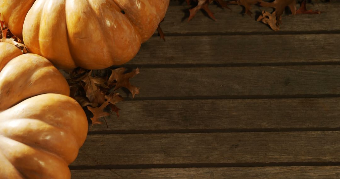 Pumpkins and Autumn Leaves on Wooden Boards - Free Images, Stock Photos and Pictures on Pikwizard.com