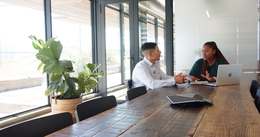 Diverse Team Collaborating in Meeting Room with Modern Decor