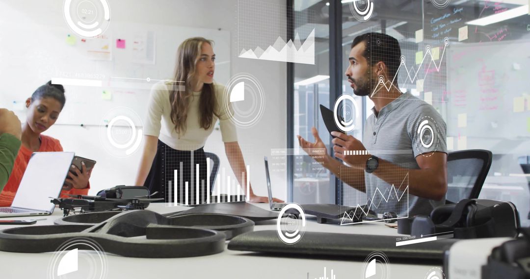 Team Discussing Drone Prototype and Data Visualization in Modern Office Collaboration