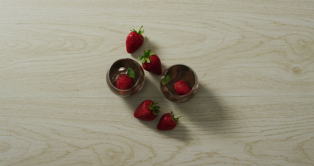 Image of chocolate pudding with strawberries on a wooden surface - Free Images, Stock Photos and Pictures on Pikwizard.com