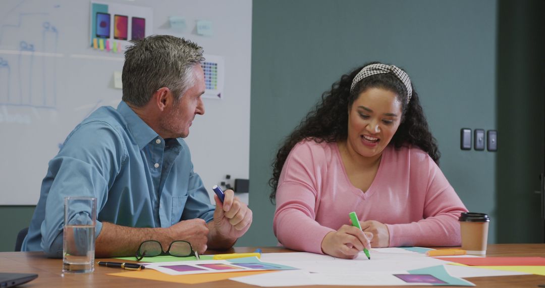 Engaged Multiracial Colleagues Collaborating in Modern Office Meeting