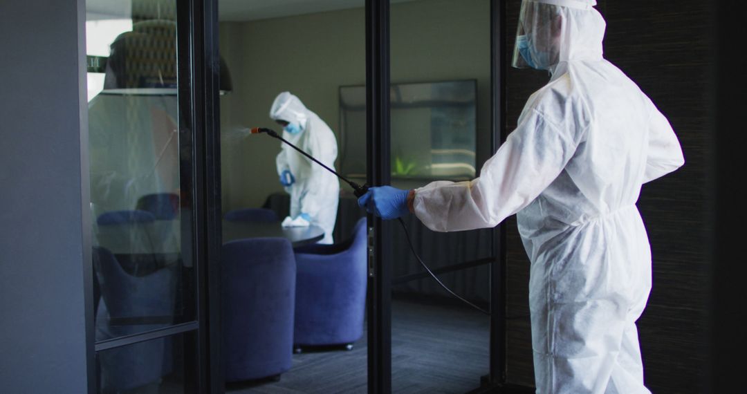 Cleaning Team in Protective Gear Disinfecting Office Space - Free Images, Stock Photos and Pictures on Pikwizard.com