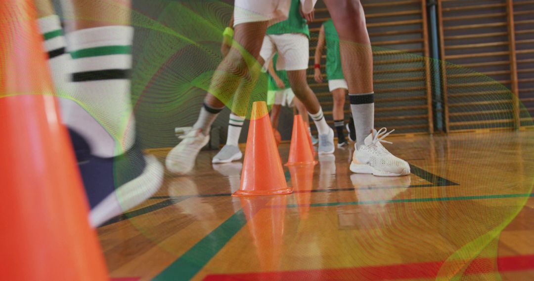Basketball Players in Agility Drill with Cones in Gymnasium