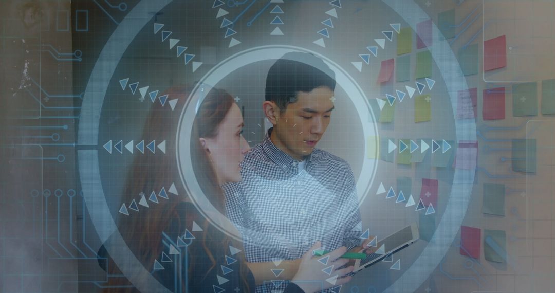 Coworkers Collaborating with Digital Interface in Modern Office