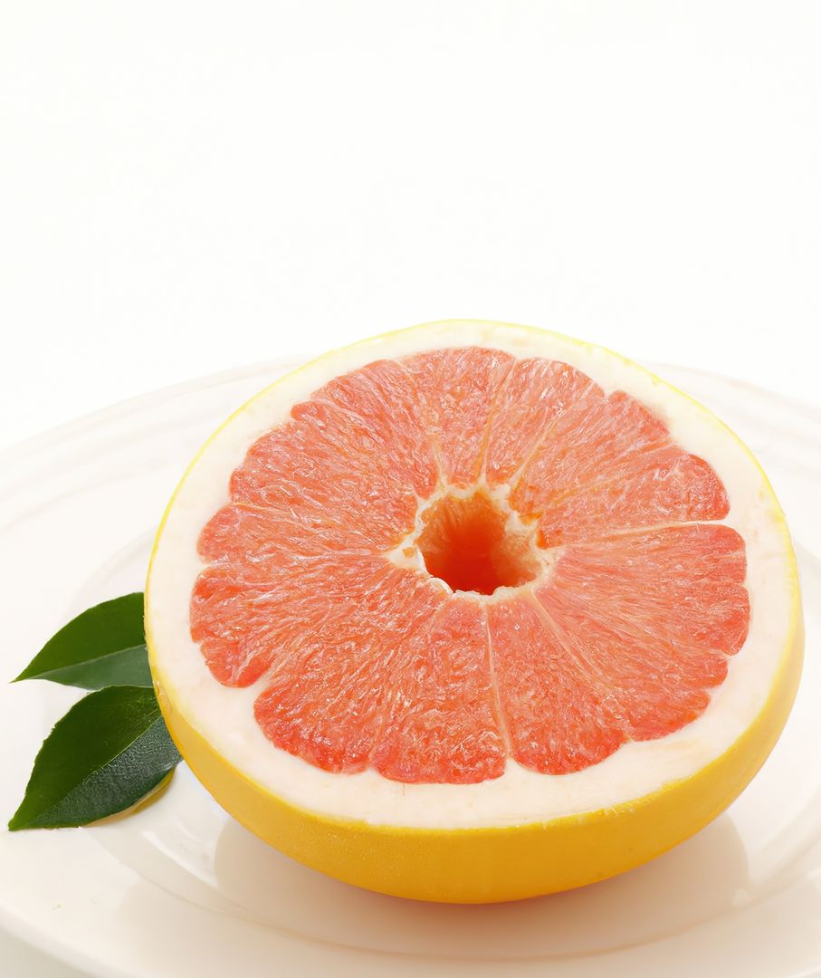 Juicy Grapefruit Cut in Half on White Background - Free Images, Stock Photos and Pictures on Pikwizard.com