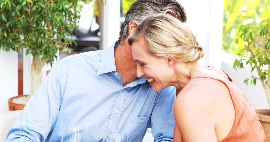 Happy Couple Enjoying a Romantic Lunch with Toasting Wine