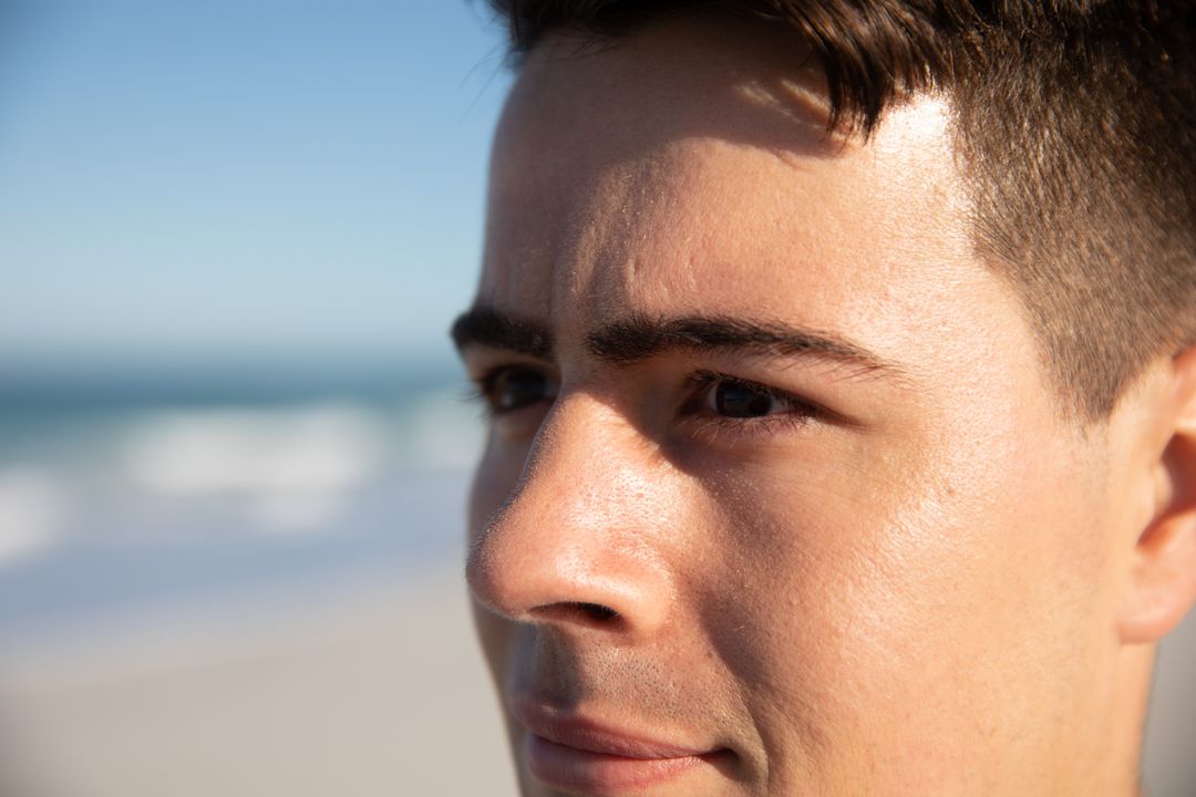 Close Up Portrait of Caucasian Man at Beach on Sunny Day - Free Images, Stock Photos and Pictures on Pikwizard.com