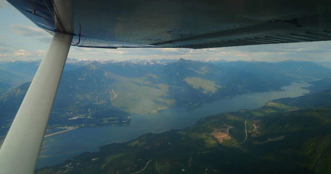 Aerial View of Serene Mountain Landscape and Winding Lake