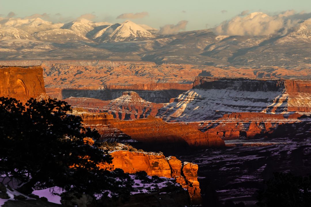 Dramatic Sunset Illuminating Snow-capped Canyons and Rocky Mountains - Free Images, Stock Photos and Pictures on Pikwizard.com