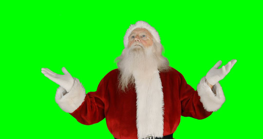 Santa Claus in Red Suit Posing Joyfully on Green Background - Free Images, Stock Photos and Pictures on Pikwizard.com