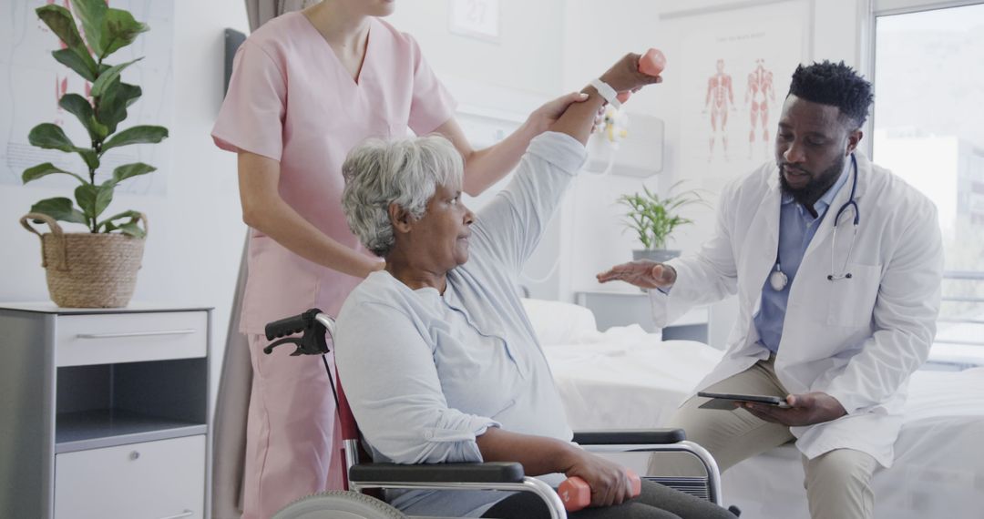 Senior Patient Undergoing Physical Therapy with Doctor and Nurse in Hospital Room - Free Images, Stock Photos and Pictures on Pikwizard.com