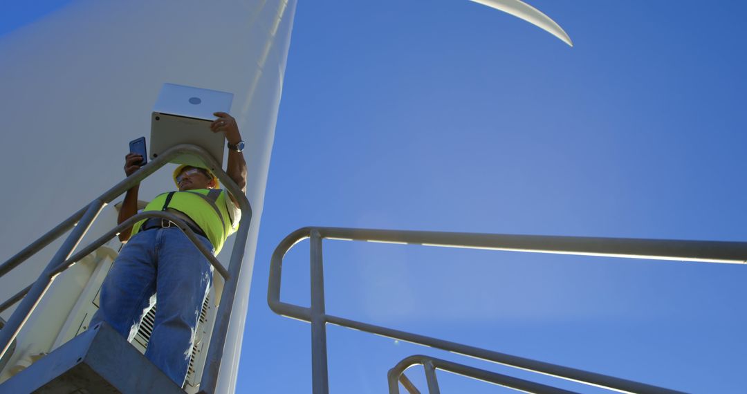 Engineer Inspecting Wind Turbine for Maintenance Work - Free Images, Stock Photos and Pictures on Pikwizard.com