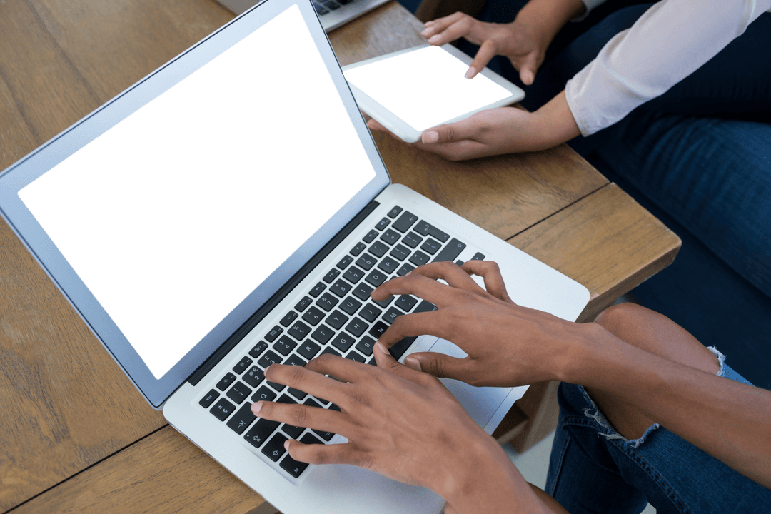 Transparent Hands Using Laptop and Tablet at Office Desk