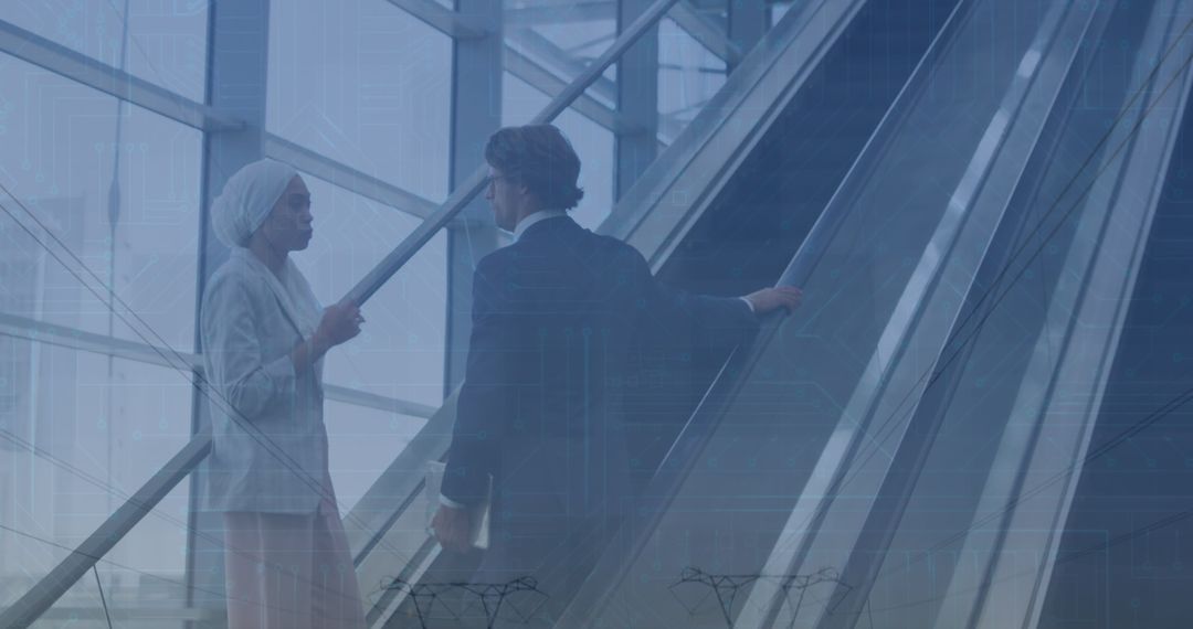 Diverse Business Discussion on Modern Escalator Overlayed with Financial Graphics