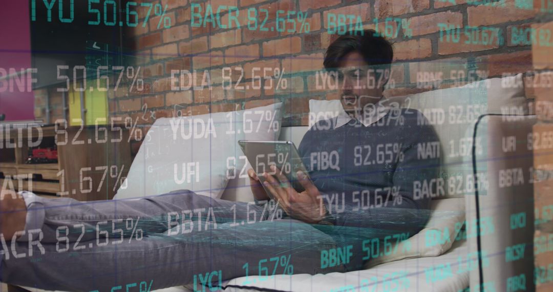 Young Professional Analyzing Financial Data on Tablet at Home