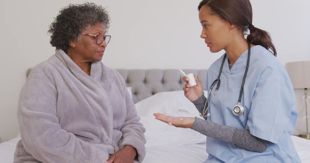 Nurse Discussing Medication with Elderly Patient at Home - Free Images, Stock Photos and Pictures on Pikwizard.com