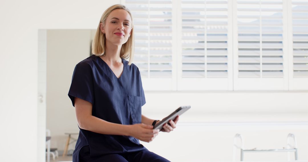 Medical Professional Using Tablet in Innovative Healthcare Setting