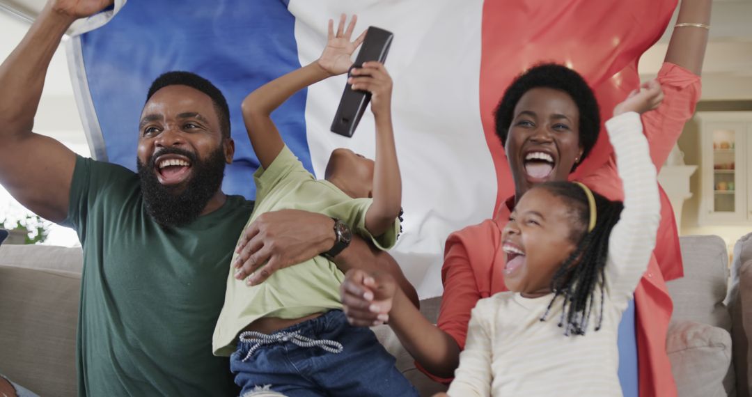 Portrait of happy african american family raising hands and supporting with flag of france at home - Free Images, Stock Photos and Pictures on Pikwizard.com