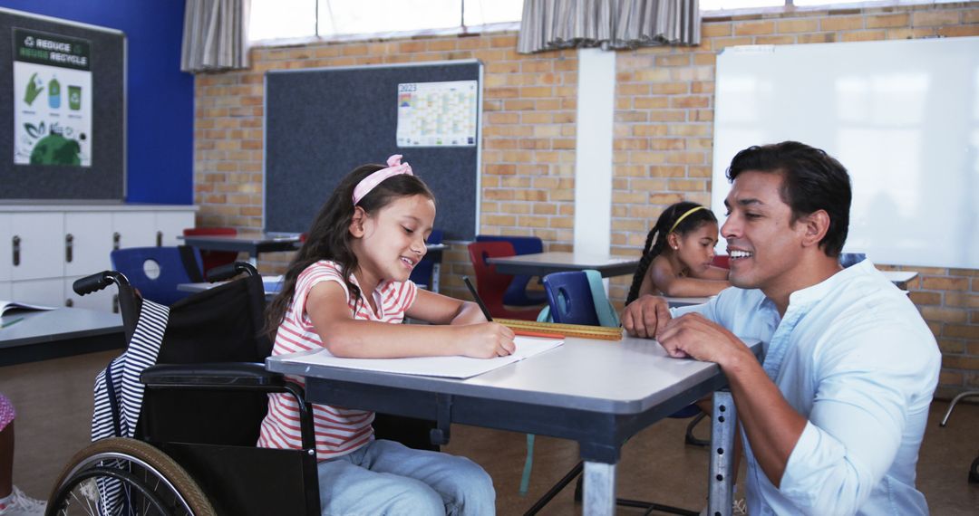 Teacher Assisting Disabled Girl in Inclusive Classroom - Free Images, Stock Photos and Pictures on Pikwizard.com