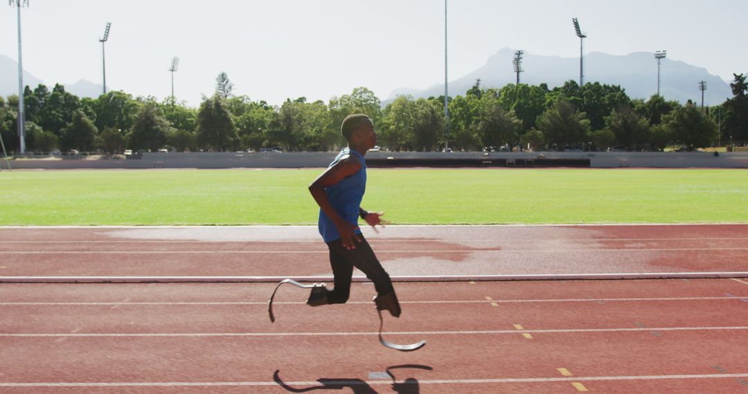 Athlete Using Running Blades Training on Track Outdoors - Free Images, Stock Photos and Pictures on Pikwizard.com