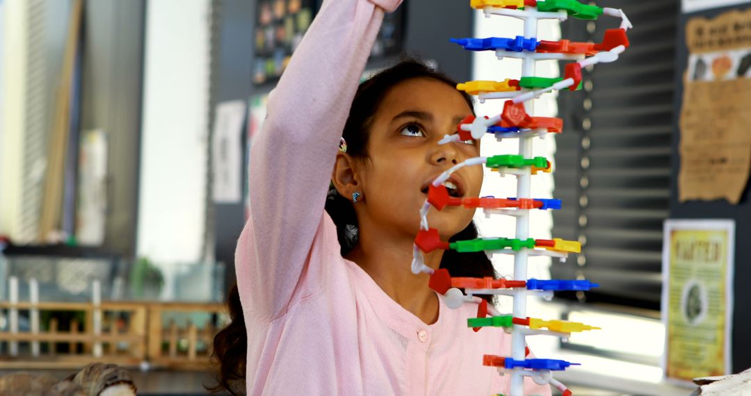 Young Girl Building Colorful Educational Structure in Classroom - Free Images, Stock Photos and Pictures on Pikwizard.com