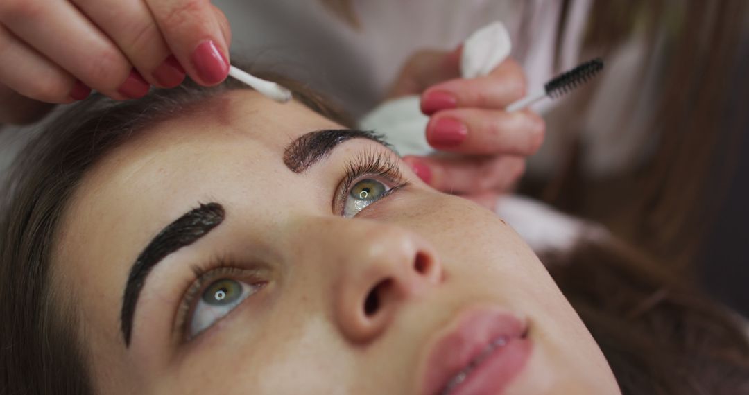 Woman Receiving Eyebrow Tinting Treatment at Beauty Salon - Free Images, Stock Photos and Pictures on Pikwizard.com