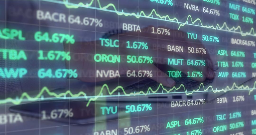 Stock Market Data Overlayed on Man Typing on Laptop