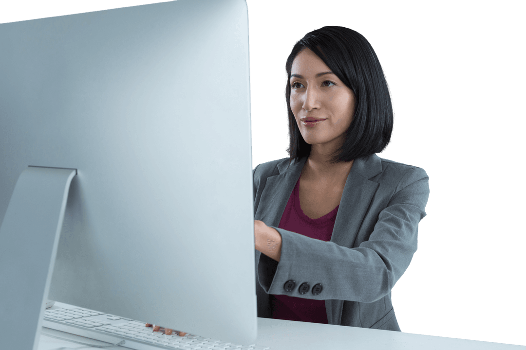 Focused Businesswoman Using Desktop Computer with Transparent Background
