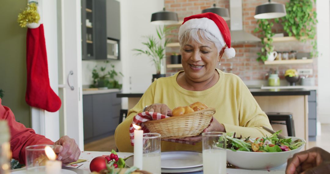 Group of happy diverse senior friends in santa hats passing food at christmas dinner table at home - Free Images, Stock Photos and Pictures on Pikwizard.com