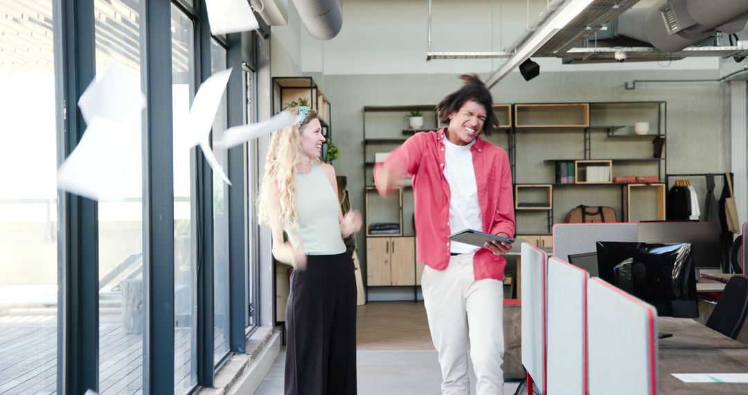 Colleagues Reviewing Project on Tablet in Modern Office