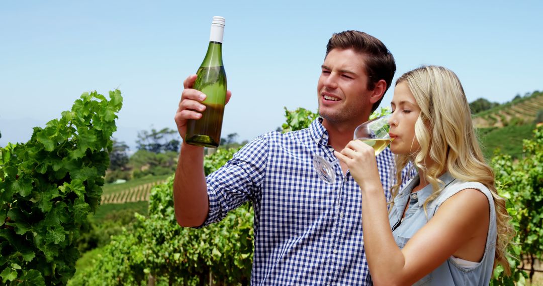 Couple Enjoying Wine Tasting in Vineyard on a Sunny Day - Free Images, Stock Photos and Pictures on Pikwizard.com