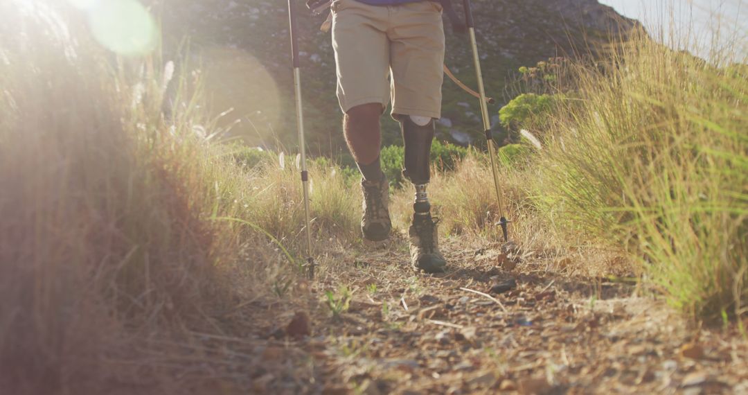 Disabled Hiker with Prosthetic Leg Trekking on Rocky Trail in Countryside - Free Images, Stock Photos and Pictures on Pikwizard.com