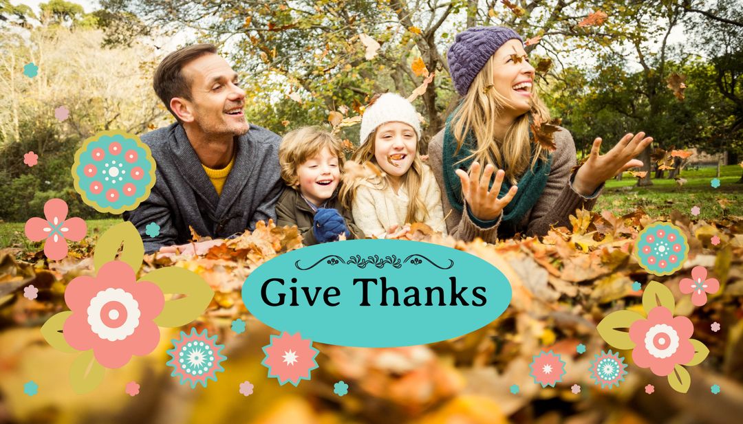 Celebrating gratitude, a joyful family plays in autumn leaves ...