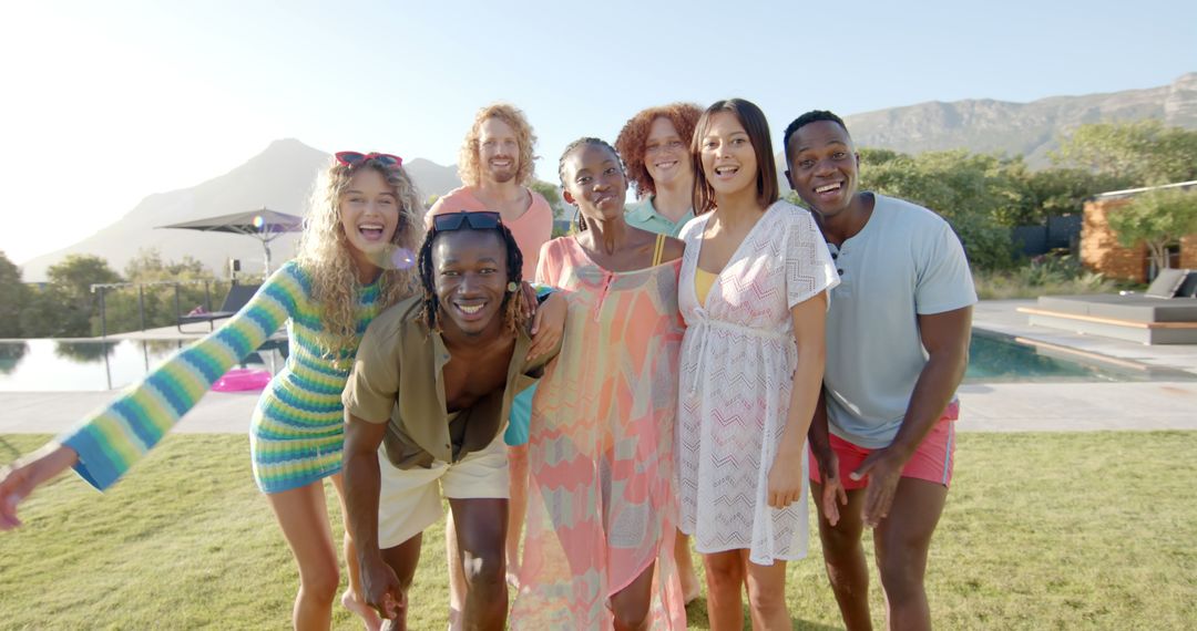 Diverse Friends Smiling by Pool on Sunny Day - Free Images, Stock Photos and Pictures on Pikwizard.com