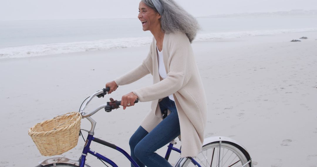 Elderly Woman Enjoying Beach Bike Ride - Free Images, Stock Photos and Pictures on Pikwizard.com