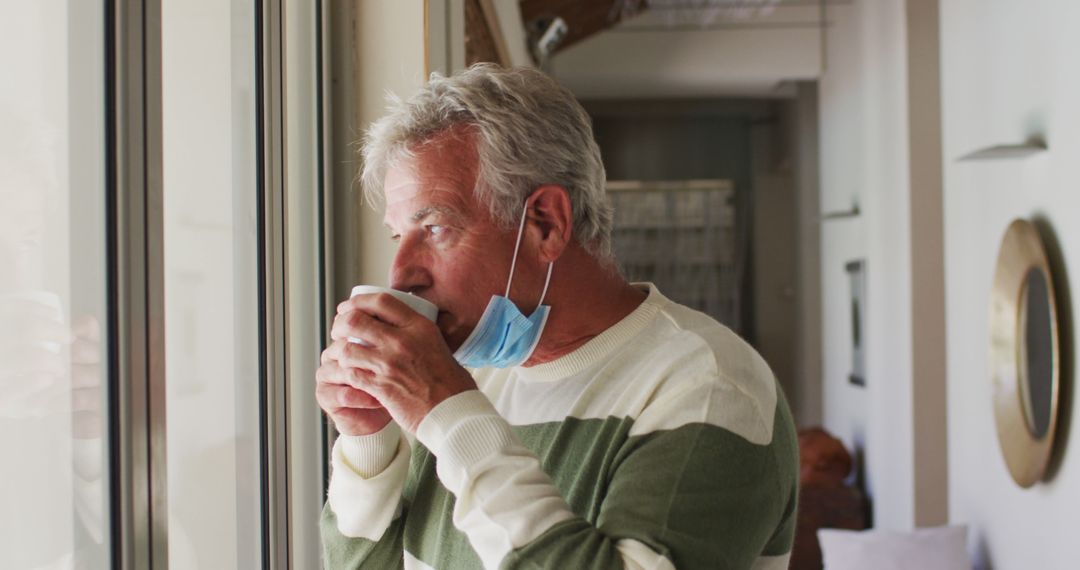 Senior Man Enjoying Coffee Indoors During Pandemic - Free Images, Stock Photos and Pictures on Pikwizard.com