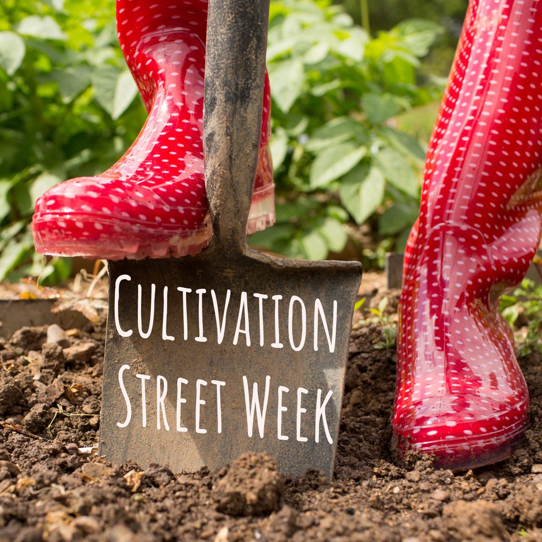 Vibrant Red Boots and Spade in Community Gardening