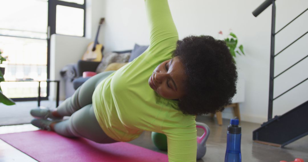 African American Woman Exercising at Home on Yoga Mat - Free Images, Stock Photos and Pictures on Pikwizard.com