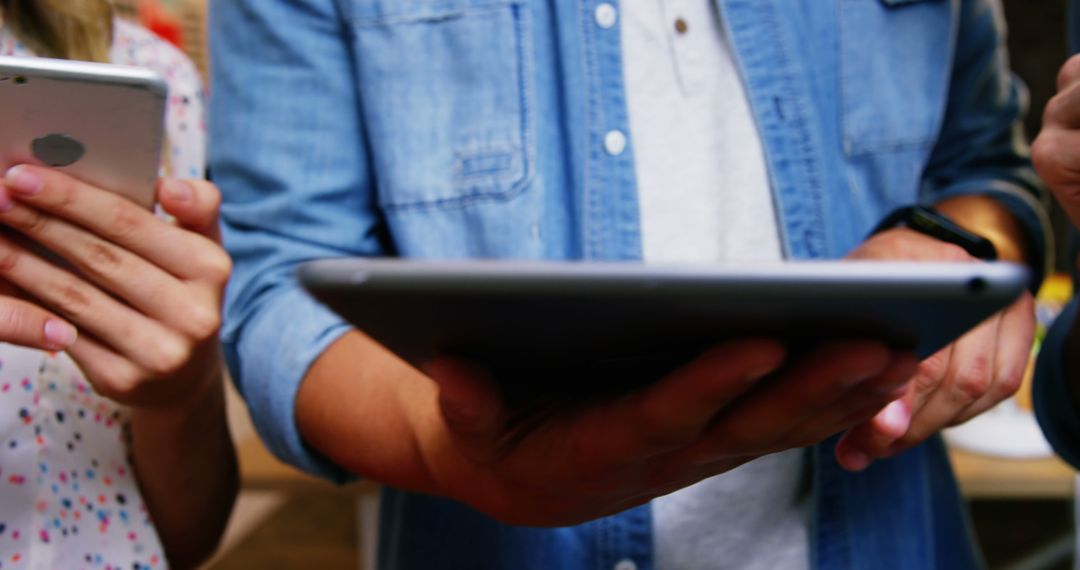 Business Professionals Using Digital Devices in Office