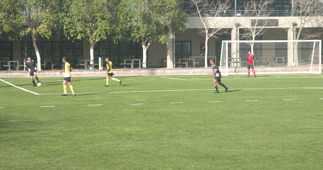 Soccer Game on School Field Highlighting Competition and Teamwork