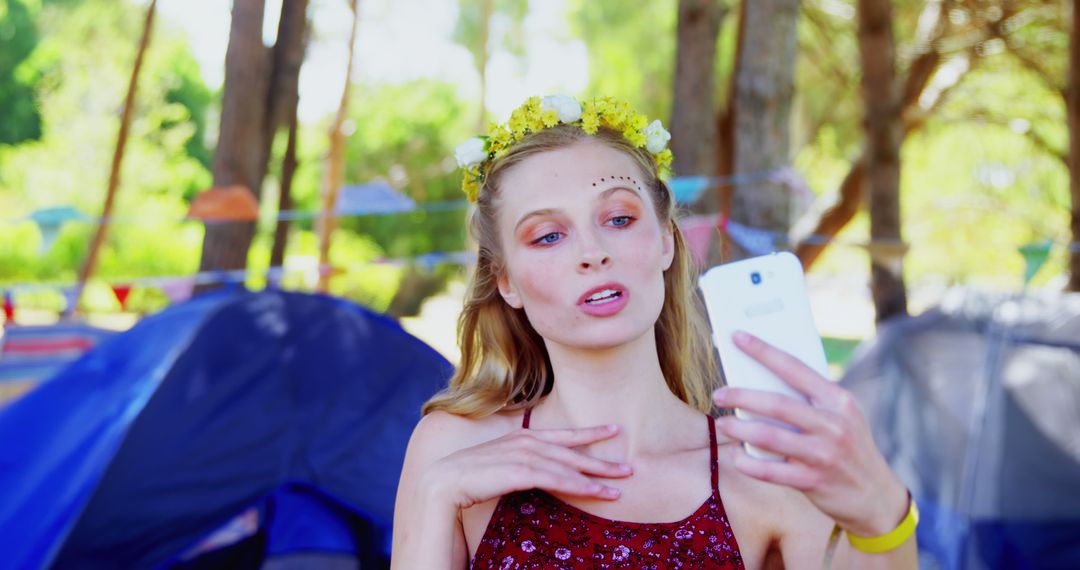 Young Woman with Flower Crown Taking Selfie at Outdoor Music Festival - Free Images, Stock Photos and Pictures on Pikwizard.com