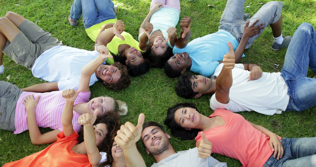 Diverse Group of Friends Lying on Grass with Thumbs Up - Free Images, Stock Photos and Pictures on Pikwizard.com