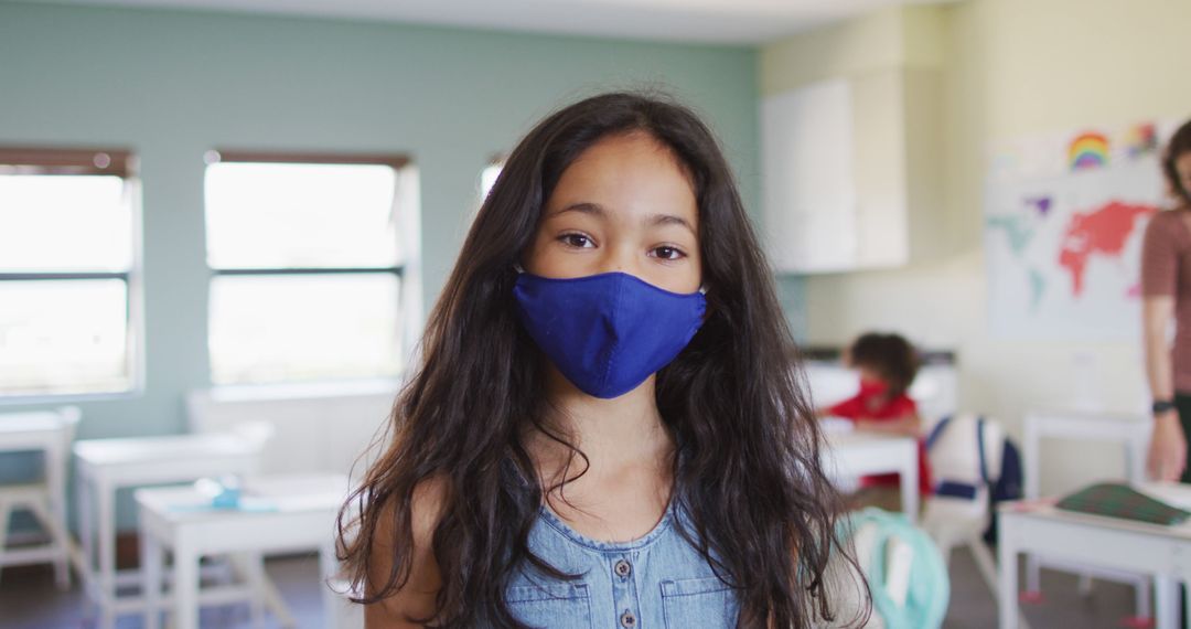 Schoolgirl Wearing Mask in Classroom During Pandemic - Free Images, Stock Photos and Pictures on Pikwizard.com