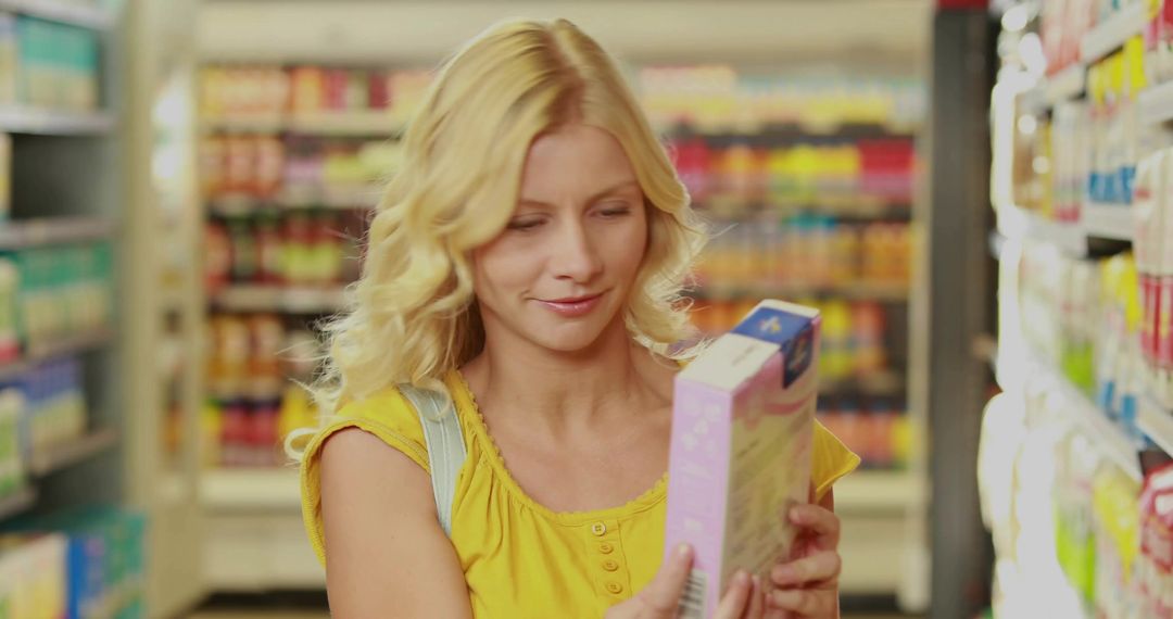 Woman Reading Product Label in Grocery Store Aisle