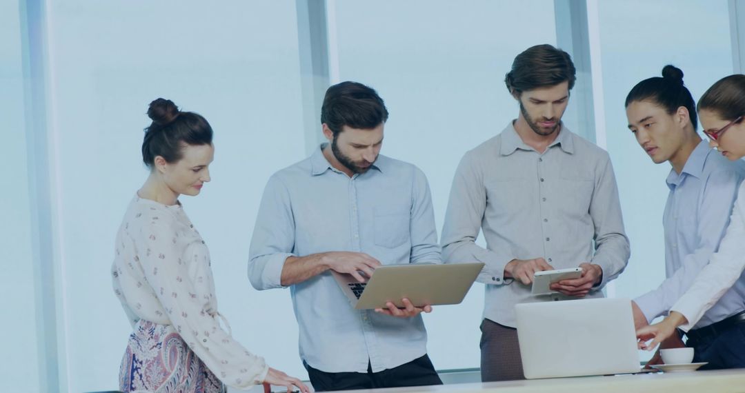 Team of Professionals Collaborating in Modern Office with Technology