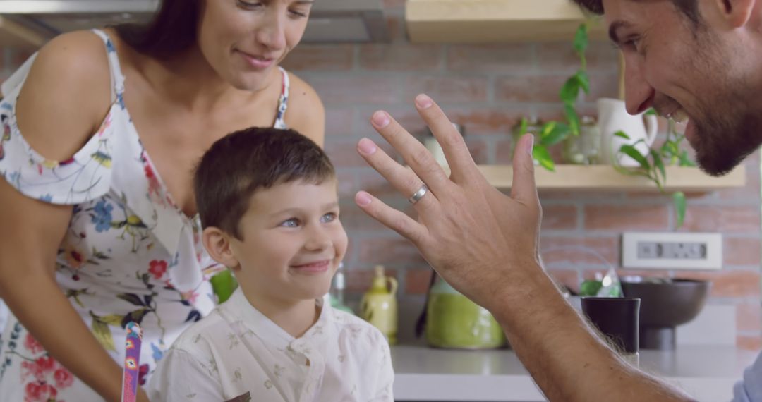 Happy Family Admires Newlywed Ring in Modern Kitchen - Free Images, Stock Photos and Pictures on Pikwizard.com