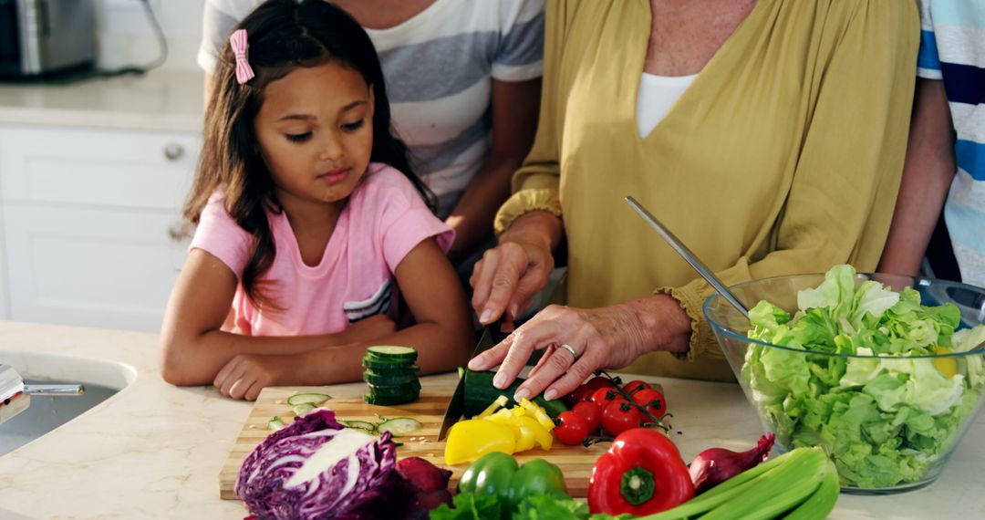 Grandmother and Granddaughter Bonding Over Chopping Vegetables - Free Images, Stock Photos and Pictures on Pikwizard.com